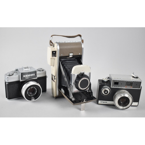 172 - A Collection of Three Vintage Cameras, Argus, Nikkorex and Polaroid Land Camera