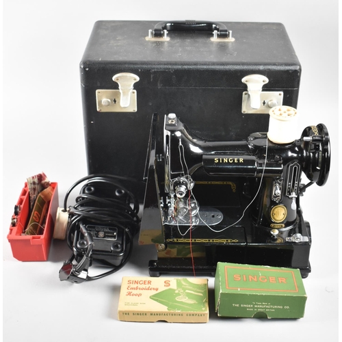 183 - A Cased Electric Singer Sewing Machine