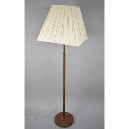 474 - A 1970s Teak and Brass Standard Lamp and Shade