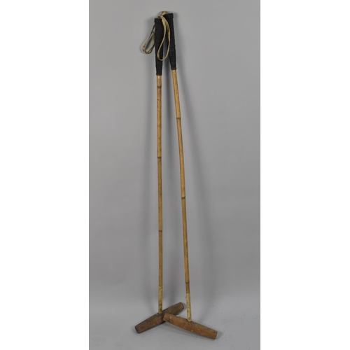 61 - A Pair of Vintage Polo Sticks by Holbrow and Co