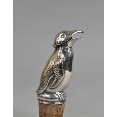 10 - A Novelty Silver Plated Wine Saver Cork in the Form of a Penguin, 9.5cms Long