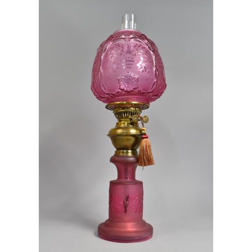 31 - A Late Victorian/Edwardian Cranberry Glass and Brass Oil Lamp, The Cylindrical Base with Frosted and... 