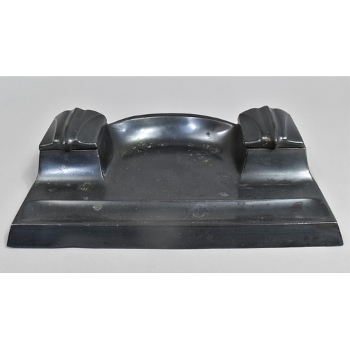 51 - A German Patinated Metal Desktop Ink Stand with Two Ink Wells having Hinged Lids, 24.5cms Wide