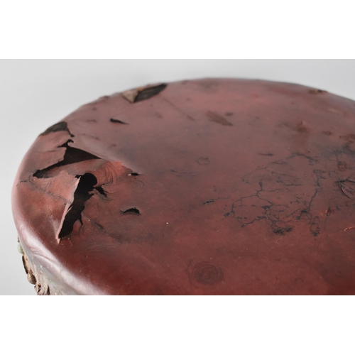 56 - A Vintage Circular Topped Stool with Leather Upholstery in need of Attention, 35cms Diameter and 53c... 