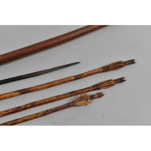 129 - A 19th Century Tribal Bow 158cm Long Together with Bamboo Arrows and a Spear Head