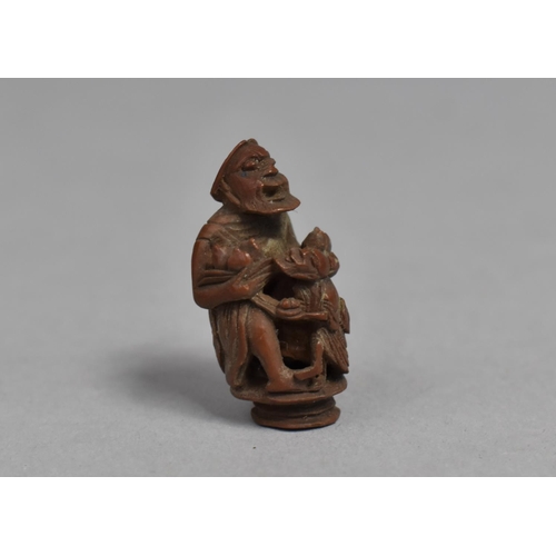 244 - A 19th Century Chinese Carved Hediao Nut in the Form of an Eldar and Attendant, 4cms High