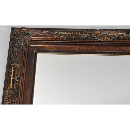 297 - A Framed Wall Mirror with Decorative Moulded Frame, 70x61cms Overall