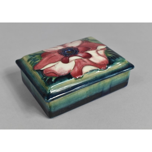 383 - A Moorcroft Lidded Box, Clematis Pattern on Blue Ground, 12cms Wide