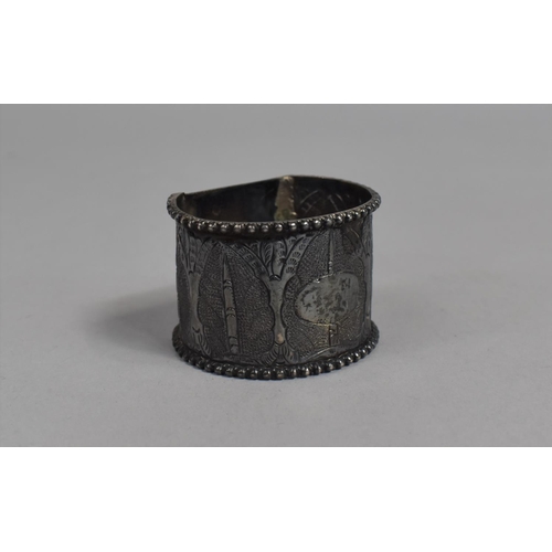 426 - An Indian White Metal Napkin Ring Decorated with Foliate Motif, 19.3g