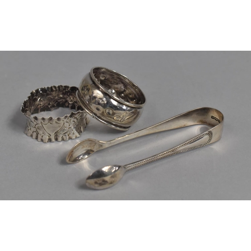 439 - Two Silver Napkin Rings Together with a Pair of Sugar Tongs, 33g