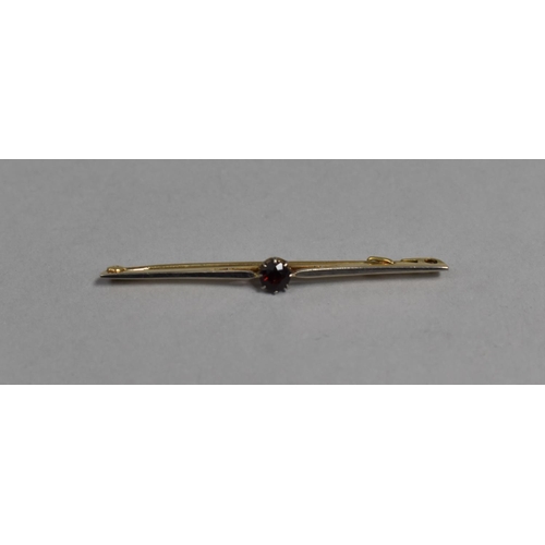 449 - An 18ct Gold Bar Brooch with Central Red Stone, 6cm Long, 3.5g