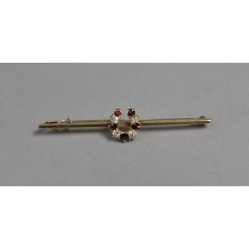 450 - A 9ct Gold Mounted Bar Brooch with Central Diamond and Ruby Horseshoe Motif, 3.2g