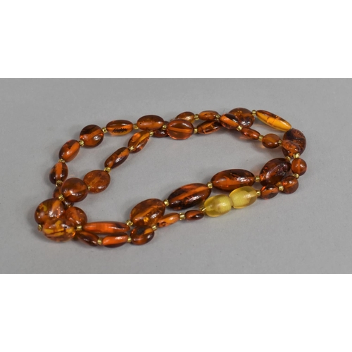 474 - A String of Amber Beads