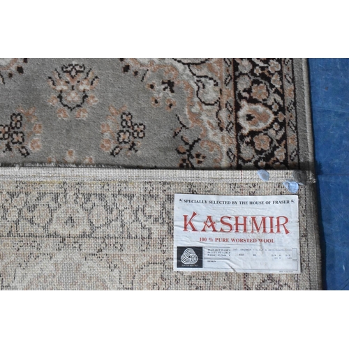 506 - A Kashmir Patterned Woollen Carpet, 180x82cms