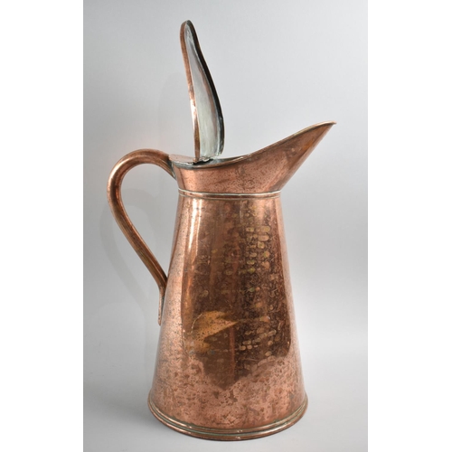 83 - A Copper Water Jug with Hinged Lid, 54cms High