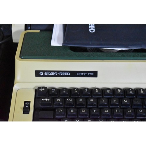 501 - A Silver Reed 2600 Electric Typewriter together with a EX133ND Model