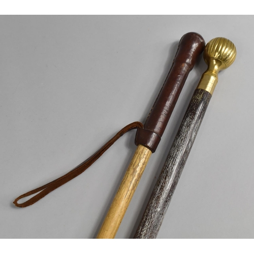 130 - A Leather Topped Walking Cane and Brass Mounted Example