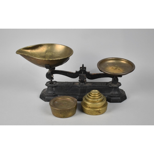 181 - A Set of Brass Mounted Black Painted Iron Kitchen Scales with Unrelated Victorian Brass Weights