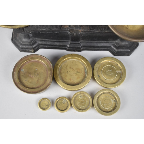 181 - A Set of Brass Mounted Black Painted Iron Kitchen Scales with Unrelated Victorian Brass Weights