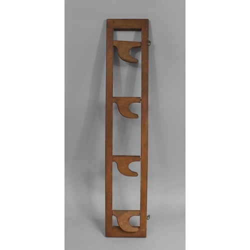 198 - A Wall Hanging Edwardian Coat Rack with Four Hinged Hooks, 70cm Wide