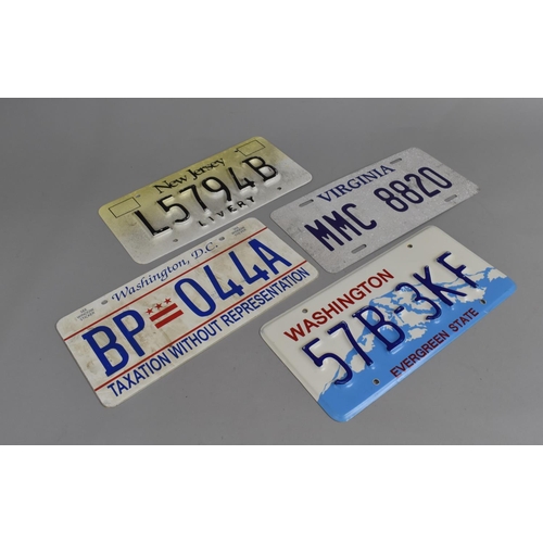 203 - A Collection of Reproduction Pressed Metal and Printed American Number Plates