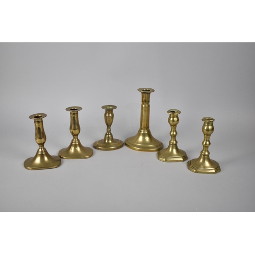 214 - A Collection of Two Pairs and Two Single Brass Candlesticks, 19th Century, Tallest 19cm