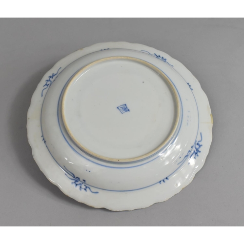 276 - An Oriental Blue and White Porcelain Plate decorated with Exterior Scene with Mountains, River and T... 