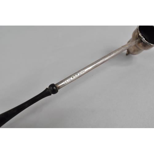 423 - A Sterling Silverand Ebony Handled Candle Snuff