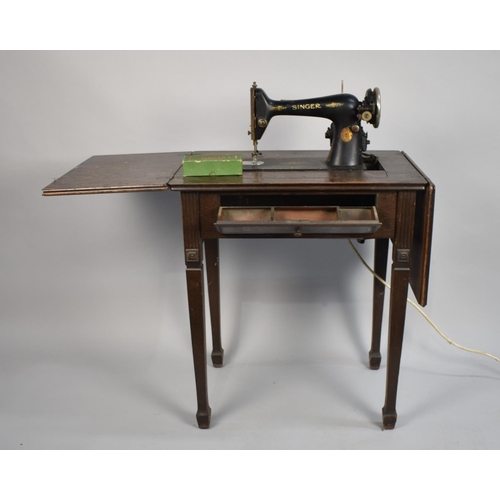 517 - An Electric Singer Sewing Machine Mounted in Drop Leaf Oak Work Table, Untested and Missing Foot Con... 