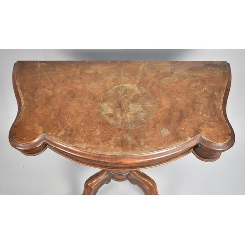 524 - A 19th Century Burr Walnut Lift and Twist Top Games Table on Four Scrolled Supports, Water Damaged T... 