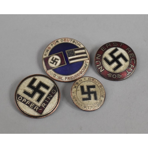 69 - A Collection of Four Reproduction Nazi Badges