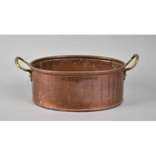 75 - A Brass Handled Oval Copper Cooking Pan, 27cms Wide