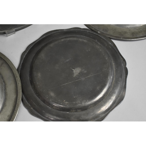 94 - An Early Pewter Charger, Three Various Plates, All with Touch Marks