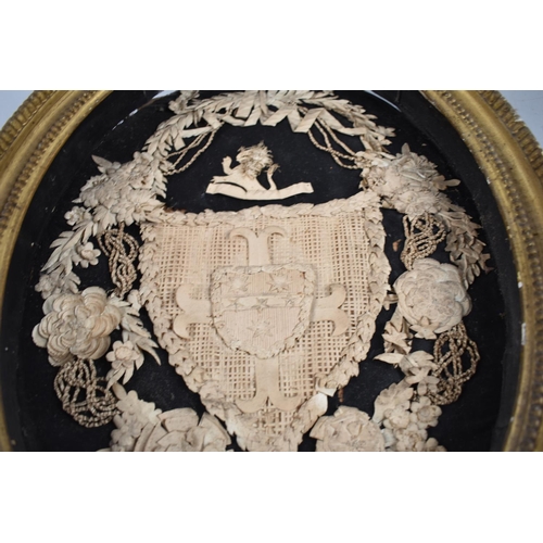 114 - A Framed Victorian French Papercraft Oval in Gilt Frame, Heraldic Shield Bordered by Garland of Flow... 