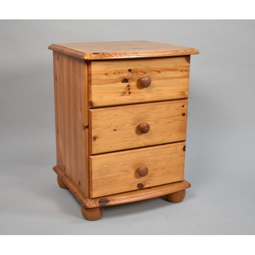 133 - A Single Pine Bedside Three Drawer Chest, 43cms Wide