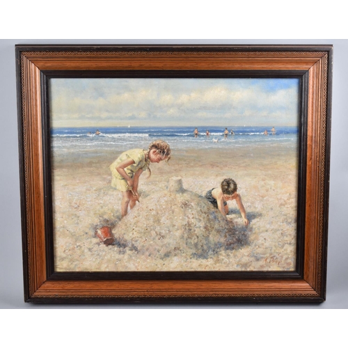 134 - A Framed Oil on Canvas, Children Building Sandcastles, 49x39cms Signed M Philip