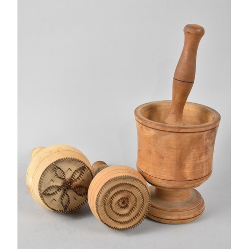 135 - A Treen Pestle and Mortar and Two Wooden Biscuit Stamps