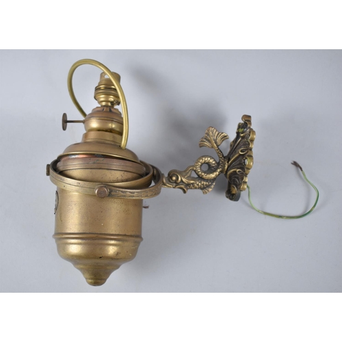 173 - A Copper and Brass Bulkhead Mounting Gimballed Ships Lamp, Originally Oil but now Converted to Elect... 