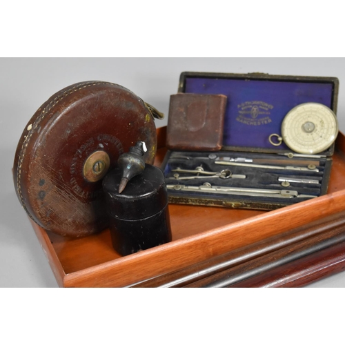 196 - A Collection of Curios to include Roller Rulers, Leather Cased Tape Measure, Geometric Instruments, ... 