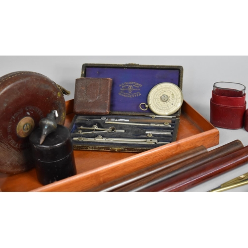 196 - A Collection of Curios to include Roller Rulers, Leather Cased Tape Measure, Geometric Instruments, ... 