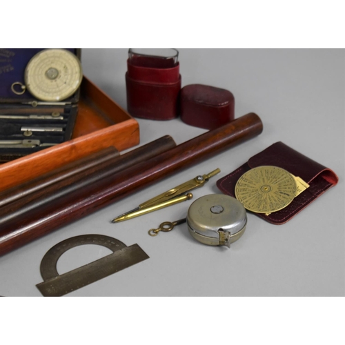 196 - A Collection of Curios to include Roller Rulers, Leather Cased Tape Measure, Geometric Instruments, ... 