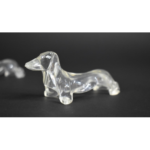 224 - A Collection of Eight Clear Plastic Knife Stands in the Form of Dachshunds