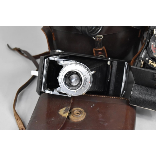 383 - A Collection of Various Vintage Cameras to comprise Zeiss Ikon Bellows Camera together with a pair o... 