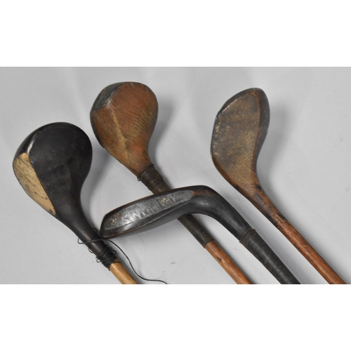 502 - A Set of Four Hickory Shafted Vintage Golf Sticks together with a Box of GBD Penfold Golf Balls