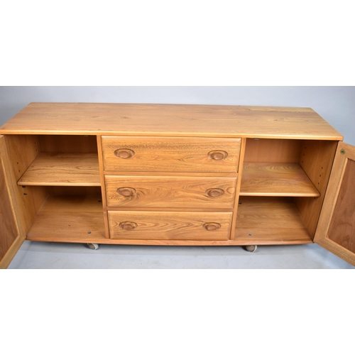 534 - An Ercol Sideboard with Three Center Drawers Flanked by Cupboards, 158cm wide