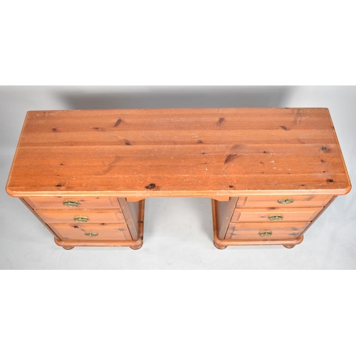 542 - A Stained Pine Kneehole Desk or Dressing Table with Three Drawers to Each Side, 132cm wide