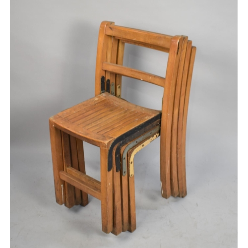 551 - A Set of Four Vintage Stacking Chairs