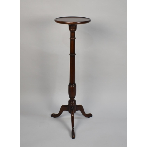 78 - An Edwardian Mahogany Circular Topped Torchere with turned Support, 30cms Diameter and 100cms High