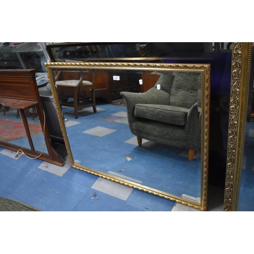 576 - A Modern Gilt Framed Wall Mirror with Bevelled Glass, 108cm x 83cm