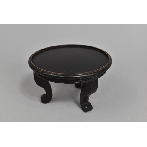 127 - An Oriental Circular Vase Stand on Three Scrolled Feet, 15cms Diameter and 8.5cms High